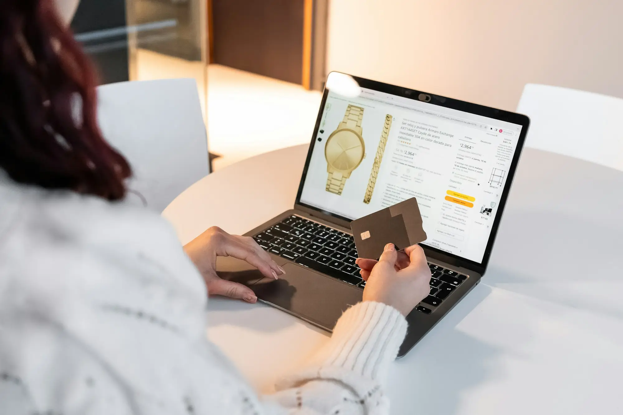 Business owner paying a supplier order online with a card
